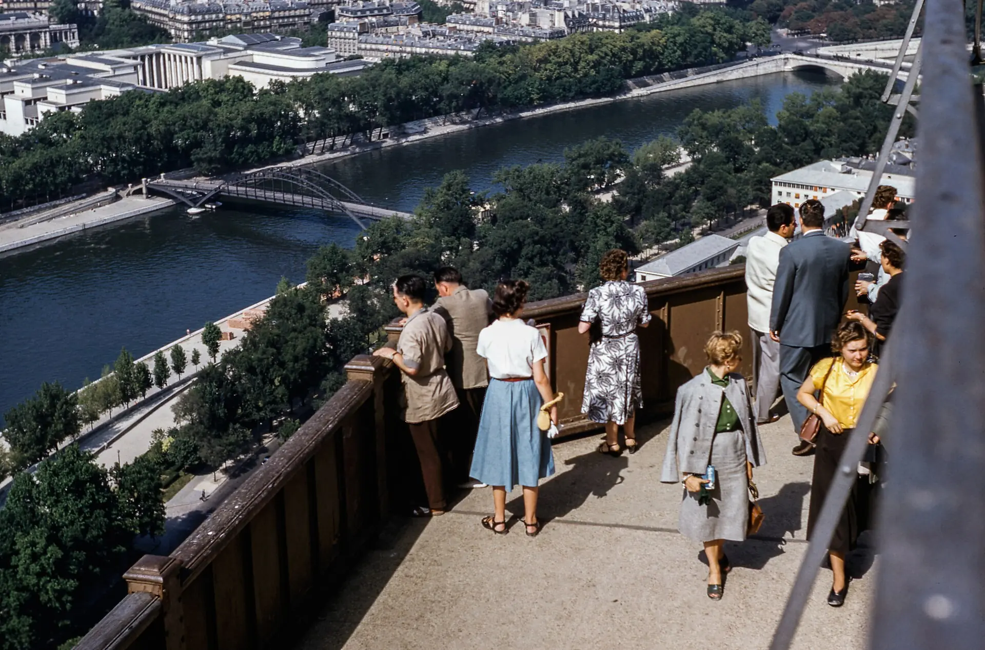 Visitors looking out over Paris from a viewing terrace