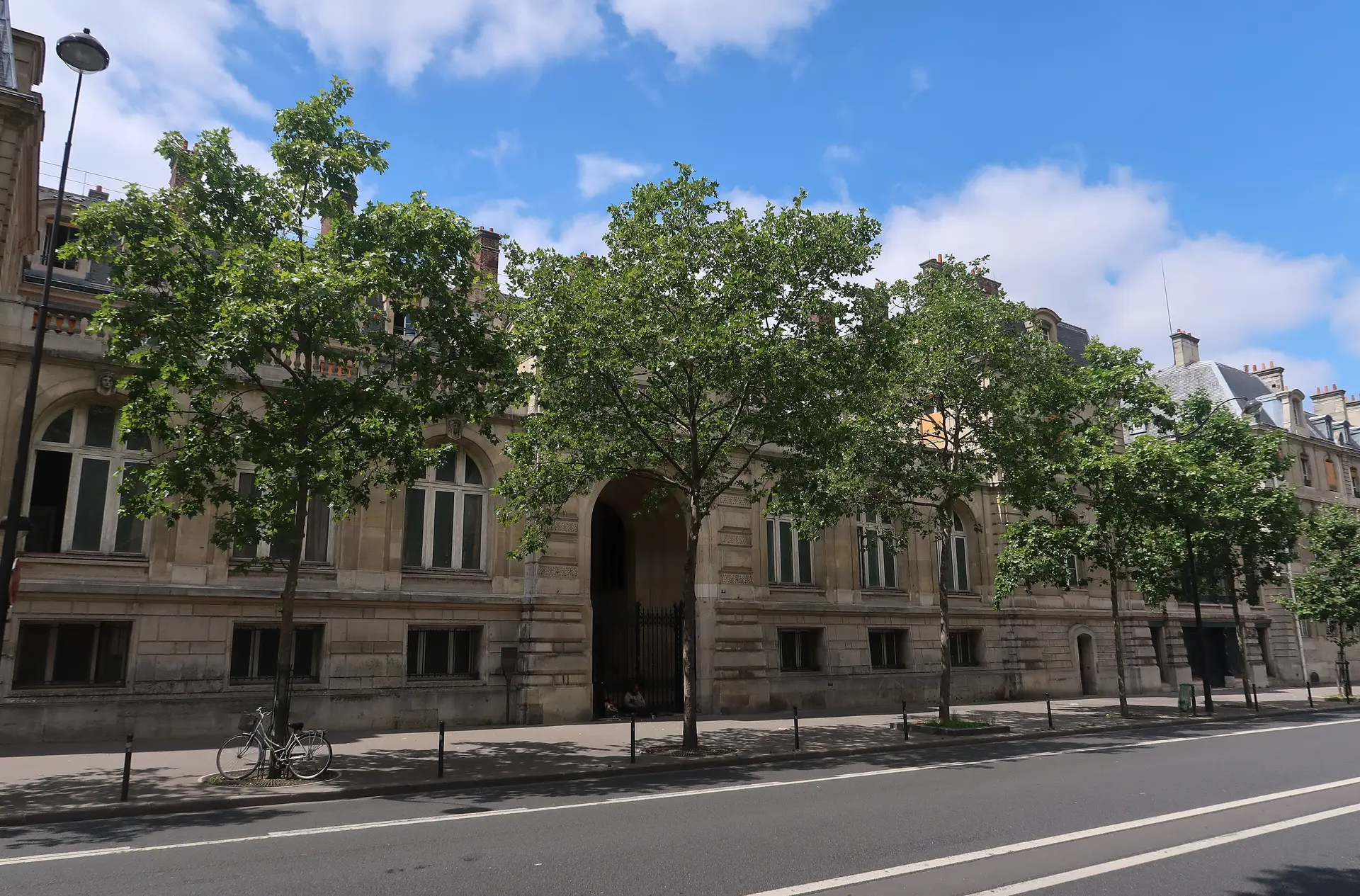 The entrance front of Mines Paris on Boulevard Saint-Michel, with trees in leaf